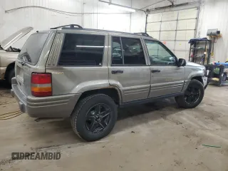 1996 Jeep Grand Cherokee Limited with VIN 1J4GZ78S5TC210710, listed as a Copart auction lot 81307904 with 285,169 mi miles and Salvage Title. Bid and sale history available at carsss.com. Image 3.