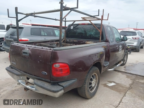2001 Ford F-150 XL with VIN 2FTRX07W31CA59129, listed as a IAAI auction lot 41349352 with 272,026 mi miles. Bid and sale history available at carsss.com. Image 4.
