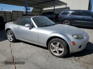 2007 Mazda MX-5 Miata Sport with VIN JM1NC25F470128936, listed as a Copart auction lot 45424585 with 123,910 mi miles and Salvage title. Bid and sale history available at DreamBid. Image 4.