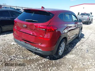 2019 Hyundai Tucson SE with VIN KM8J2CA41KU926156, listed as a IAAI auction lot 41888461 with 91,094 mi miles. Bid and sale history available at carsss.com. Image 4.
