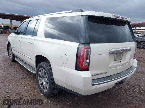 2015 GMC Yukon XL Denali with VIN 1GKS2JKJ2FR590502, listed as a IAAI auction lot 41758575 with 129,777 mi miles. Bid and sale history available at carsss.com. Image 3.