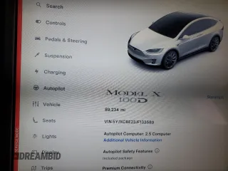 2018 Tesla Model X 75D with VIN 5YJXCBE23JF133589, listed as a Copart auction lot 55573715 with 89,234 mi miles and Salvage Title. Bid and sale history available at DreamBid. Image 9.
