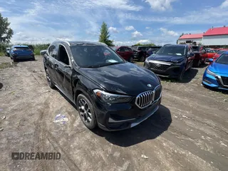 2021 BMW X1 xDrive28i with VIN WBXJG9C08M5T96965, listed as a Copart auction lot 64238615 with 23,067 mi miles and Clean title. Bid and sale history available at DreamBid. Image 1.