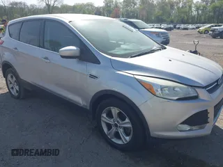 2015 Ford Escape SE with VIN 1FMCU9GX9FUC19545, listed as a IAAI auction lot 42128800 with 157,506 mi miles. Bid and sale history available at carsss.com. Image 1.