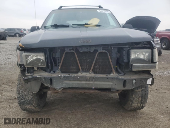 1998 Jeep Grand Cherokee Laredo with VIN 1J4GZ58S2WC281923, listed as a Copart auction lot 44010885 with 210,959 mi miles and Salvage Title. Bid and sale history available at carsss.com. Image 5.