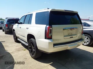2015 GMC Yukon Denali with VIN 1GKS1CKJ8FR575730, listed as a IAAI auction lot 42048050 with 113,077 mi miles. Bid and sale history available at carsss.com. Image 3.