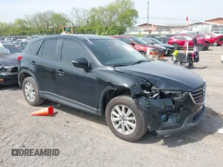 2016 Mazda CX-5 Sport with VIN JM3KE4BY8G0746377, listed as a IAAI auction lot 41990988 with 144,558 mi miles and . Bid and sale history available at carsss.com. Image 1.