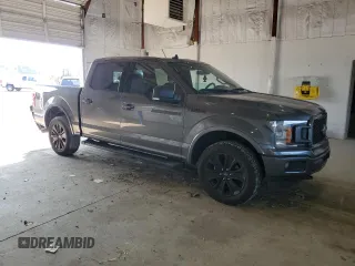 2020 Ford F-150 XL with VIN 1FTEW1E44LFC02735, listed as a Copart auction lot 62062125 with 111,471 mi miles and Salvage title. Bid and sale history available at DreamBid. Image 4.