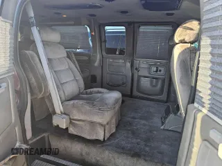 2004 Chevrolet Express Passenger z VIN 1GBFG15T141225336, wystawiony jako Copart lot #79581294 z przebiegiem Nie podano mil oraz Czysty tytuł • Clean title. Historia ofert i sprzedaży dostępna na DreamBid. Obrazek 6.
