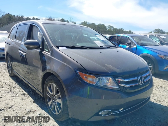 2014 Honda Odyssey Touring with VIN 5FNRL5H92EB016546, listed as a IAAI auction lot 41689148 with 143,601 mi miles and . Bid and sale history available at DreamBid. Image 1.