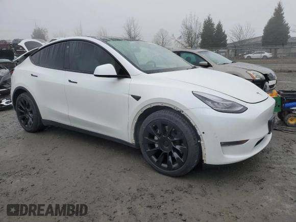 2021 Tesla Model Y Long Range with VIN 5YJYGDEE1MF267004, listed as a Copart auction lot 88708485 with 65,669 mi miles and Salvage Title. Bid and sale history available at DreamBid. Image 4.