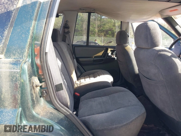 1996 Jeep Grand Cherokee with VIN 1J4EZ58Y7TC128428, listed as a IAAI auction lot 42050443 with 241,591 mi miles and . Bid and sale history available at DreamBid. Image 8.