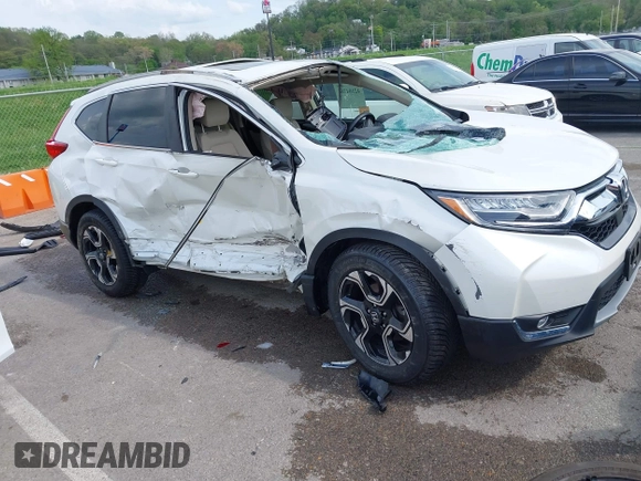 2018 Honda CR-V Touring with VIN 5J6RW2H99JL020598, listed as a IAAI auction lot 42104765 with 30,431 mi miles and . Bid and sale history available at carsss.com. Image 1.
