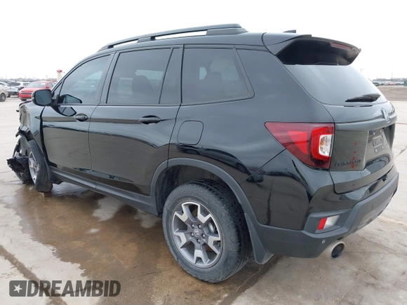 2023 Honda Passport TrailSport with VIN 5FNYF8H67PB006933, listed as a IAAI auction lot 41597859 with 34,145 mi miles and . Bid and sale history available at carsss.com. Image 3.