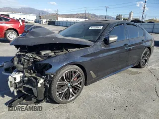 2021 BMW 5 Series M550i xDrive z VIN WBA13BK06MCF92173, wystawiony jako Copart lot #87707035 z przebiegiem Nie podano mil oraz Szkoda całkowita • Salvage title. Historia ofert i sprzedaży dostępna na DreamBid. Obrazek 1.
