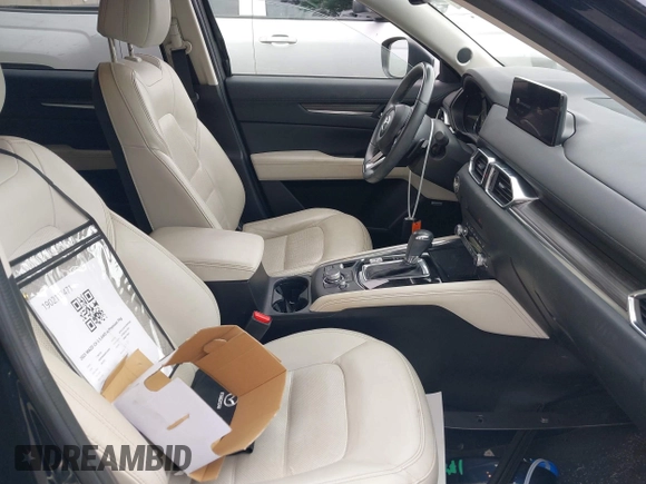 2023 Mazda CX-5 S Premium with VIN JM3KFBDM4P0185865, listed as a IAAI auction lot 42040234 with 32,761 mi miles and . Bid and sale history available at DreamBid. Image 5.