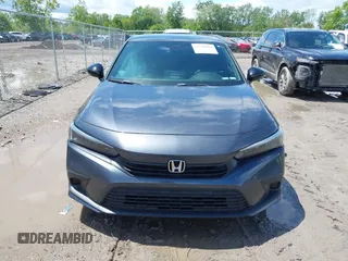 2022 Honda Civic Sport z VIN 2HGFE2F58NH560511, wystawiony jako IAAI lot #42346044 z przebiegiem 51 357 mil mil oraz . Historia ofert i sprzedaży dostępna na DreamBid. Obrazek 13.