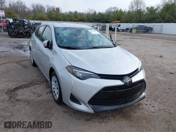 2019 Toyota Corolla L with VIN 5YFBURHE2KP934042, listed as a IAAI auction lot 41963491 with 87,299 mi miles. Bid and sale history available at carsss.com. Image 1.
