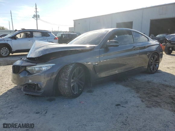 2015 BMW 4 Series 435i xDrive with VIN WBA3R5C56FK371987, listed as a Copart auction lot 88077015 with 0 mi miles and Salvage Title. Bid and sale history available at carsss.com. Image 1.
