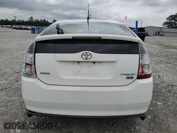 2006 Toyota Prius z VIN JTDKB20U867527026, wystawiony jako Copart lot #59057765 z przebiegiem 248 523 mil mil oraz Nie do naprawy • Non repairable. Historia ofert i sprzedaży dostępna na DreamBid. Obrazek 6.