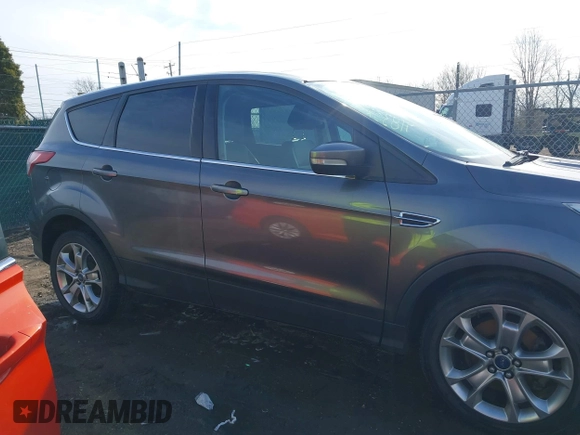 2013 Ford Escape SEL with VIN 1FMCU9H92DUA24934, listed as a IAAI auction lot 41832566 with 124,705 mi miles. Bid and sale history available at carsss.com. Image 13.