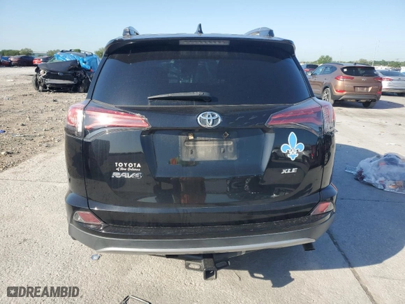 2018 Toyota RAV4 XLE with VIN 2T3WFREV2JW472232, listed as a Copart auction lot 52464025 with 131,421 mi miles and Salvage Title. Bid and sale history available at carsss.com. Image 6.
