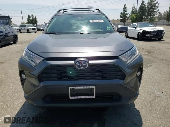 2020 Toyota RAV4 Hybrid XLE with VIN JTMRWRFV7LD063381, listed as a Copart auction lot 60661275 with 70,544 mi miles and Salvage title. Bid and sale history available at DreamBid. Image 14.