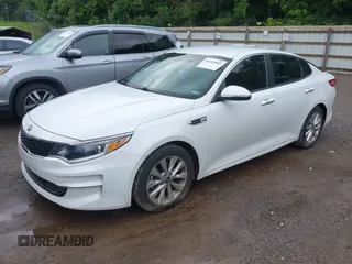 2018 Kia Optima S with VIN 5XXGT4L36JG265878, listed as a IAAI auction lot 42302801 with 101,927 mi miles and . Bid and sale history available at DreamBid. Image 2.