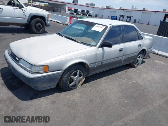 1988 Mazda 626 z VIN JM1GD2221J1550574, wystawiony jako IAAI lot #42415062 z przebiegiem 190 747 mil mil oraz . Historia ofert i sprzedaży dostępna na DreamBid. Obrazek 2.