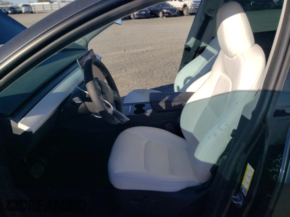 2024 Tesla Model Y Long Range with VIN 7SAYGDEE8RF002655, listed as a Copart auction lot 46422325 with 7,943 mi miles and Salvage Title. Bid and sale history available at DreamBid. Image 7.