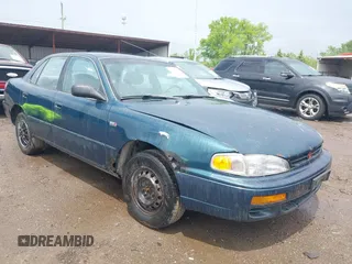 1996 Toyota Camry DX z VIN 4T1BG12K2TU747732, wystawiony jako IAAI lot #42245927 z przebiegiem 416 491 mil mil oraz . Historia ofert i sprzedaży dostępna na DreamBid. Obrazek 1.