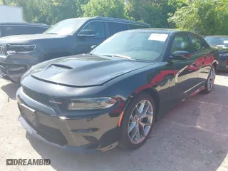 2023 Dodge Charger GT with VIN 2C3CDXHG8PH579373, listed as a IAAI auction lot 42001295 with 57,006 mi miles. Bid and sale history available at carsss.com. Image 2.