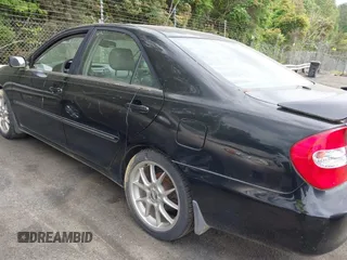 2003 Toyota Camry LE with VIN JTDBF32K430146557, listed as a IAAI auction lot 42102454 with 179,653 mi miles. Bid and sale history available at carsss.com. Image 6.