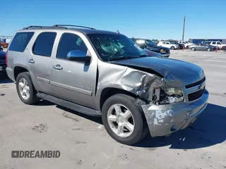 2007 Chevrolet Tahoe LTZ z VIN 1GNFC13J97R155705, wystawiony jako IAAI lot #40914171 z przebiegiem 165 727 mil mil oraz . Historia ofert i sprzedaży dostępna na DreamBid. Obrazek 1.