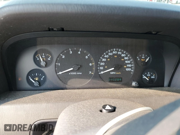 1999 Jeep Grand Cherokee Laredo with VIN 1J4G258S9XC731752, listed as a Copart auction lot 58601555 with 245,284 mi miles and Salvage title. Bid and sale history available at DreamBid. Image 9.