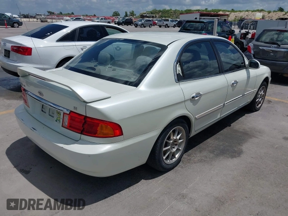 2002 Kia Optima LX z VIN KNAGD126325144218, wystawiony jako IAAI lot #42596691 z przebiegiem 220 972 mil mil oraz . Historia ofert i sprzedaży dostępna na DreamBid. Obrazek 4.
