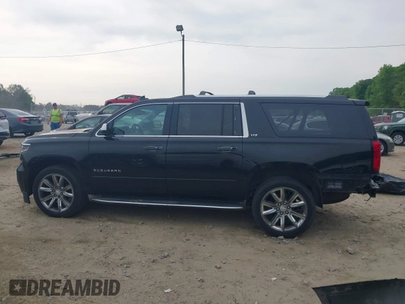 2015 Chevrolet Suburban LTZ with VIN 1GNSCKKCXFR731873, listed as a IAAI auction lot 42069917 with 108,963 mi miles and . Bid and sale history available at DreamBid. Image 15.