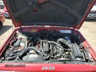 1992 Jeep Cherokee with VIN 1J4FJ58S0NL140995, listed as a Copart auction lot 56705875 with 253,657 mi miles and Salvage title. Bid and sale history available at DreamBid. Image 12.