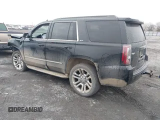 2016 GMC Yukon SLT with VIN 1GKS1BKC9GR480199, listed as a IAAI auction lot 41352032 with 146,716 mi miles. Bid and sale history available at carsss.com. Image 3.
