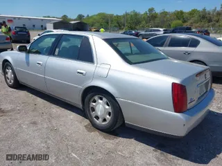 2001 Cadillac DeVille with VIN 1G6KD54Y91U235374, listed as a IAAI auction lot 41874980 with 136,090 mi miles. Bid and sale history available at carsss.com. Image 3.