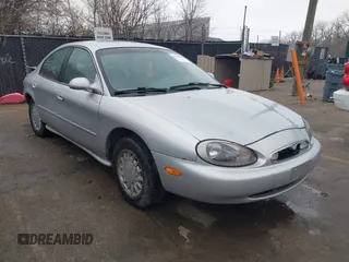 1996 Mercury Sable GS z VIN 1MELM50U6TG663309, wystawiony jako IAAI lot #41808038 z przebiegiem 96 389 mil mil oraz . Historia ofert i sprzedaży dostępna na DreamBid. Obrazek 1.