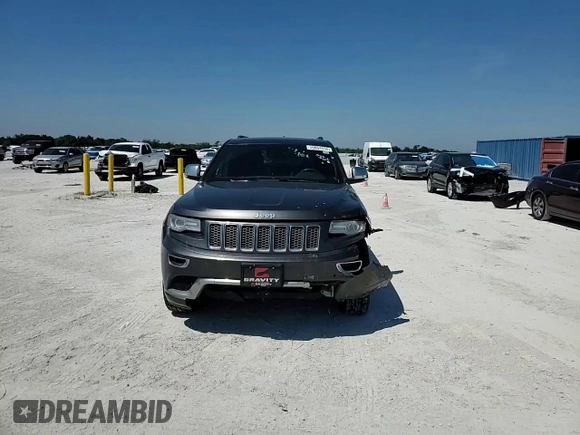2014 Jeep Grand Cherokee Summit with VIN 1C4RJFJGXEC159438, listed as a Copart auction lot 50864595 with 134,558 mi miles and Salvage title. Bid and sale history available at DreamBid. Image 12.