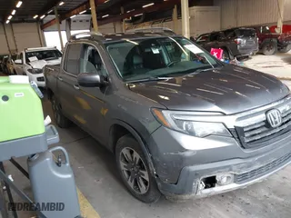 2017 Honda Ridgeline RTL-E with VIN 5FPYK3F73HB034764, listed as a IAAI auction lot 41146866 with 125,885 mi miles. Bid and sale history available at carsss.com. Image 1.