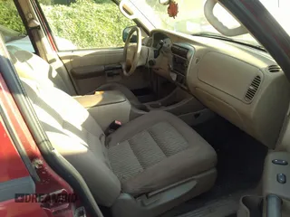 2005 Ford Explorer Sport Trac XLS z VIN 1FMZU67K45UB31837, wystawiony jako IAAI lot #32903073 z przebiegiem 127 538 mil mil oraz . Historia ofert i sprzedaży dostępna na DreamBid. Obrazek 5.
