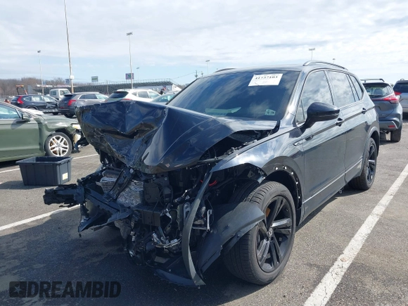 2023 Volkswagen Tiguan SE R-Line Black with VIN 3VVCB7AXXPM094621, listed as a IAAI auction lot 41737103 with 21,069 mi miles and . Bid and sale history available at DreamBid. Image 17.