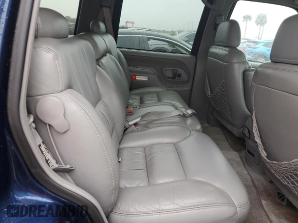 1999 GMC Yukon with VIN 1GKEK13R2XJ739931, listed as a Copart auction lot 74583734 with 115,605 mi miles and Salvage Title. Bid and sale history available at carsss.com. Image 11.