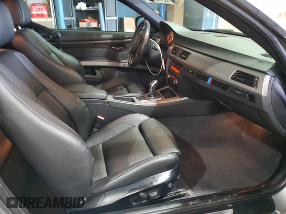 2011 BMW 3 Series 335is with VIN WBAKG1C56BE599457, listed as a Copart auction lot 52412655 with 134,497 mi miles and Clean title. Bid and sale history available at DreamBid. Image 8.