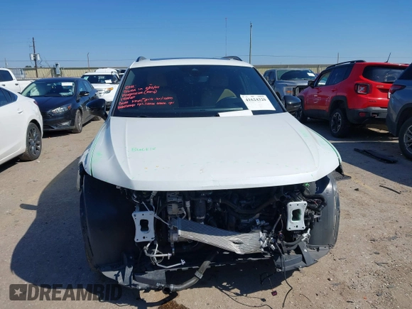 2022 Volkswagen Tiguan SE R-Line Black with VIN 3VVCB7AX4NM165115, listed as a IAAI auction lot 41624320 with 18,074 mi miles and . Bid and sale history available at DreamBid. Image 12.