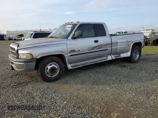 2001 Dodge Ram 3500 with VIN 1B7MC33W71J574245, listed as a Copart auction lot 84877774 with 200,945 mi miles and Salvage Title. Bid and sale history available at carsss.com. Image 1.