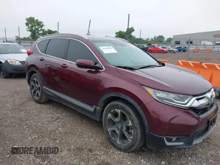 2019 Honda CR-V Touring with VIN 7FARW1H94KE014233, listed as a IAAI auction lot 42420642 with 77,371 mi miles and . Bid and sale history available at DreamBid. Image 1.